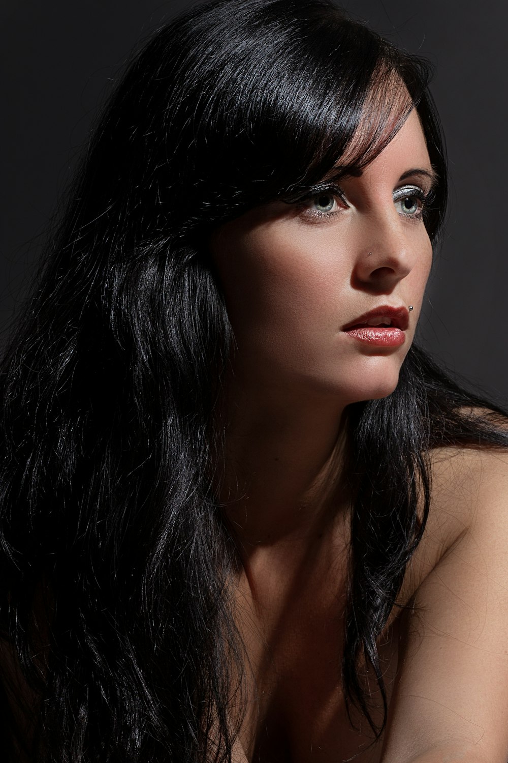 woman with black hair and red lipstick