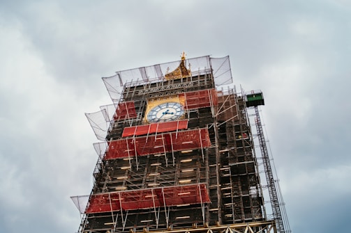 red and black tower under white sky during daytime