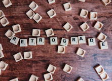 brown wooden letter blocks on brown wooden table