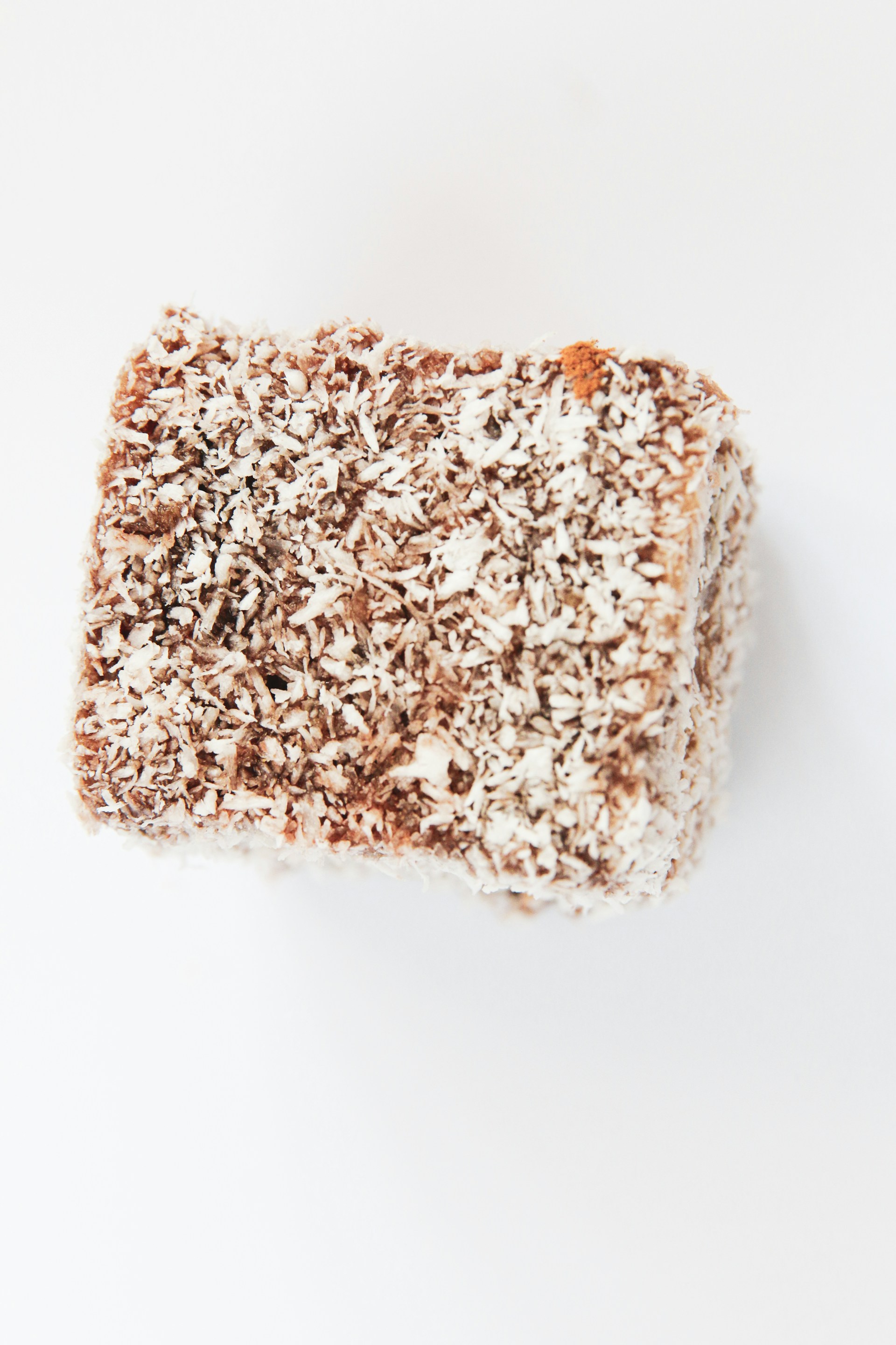 white and brown rice on white surface