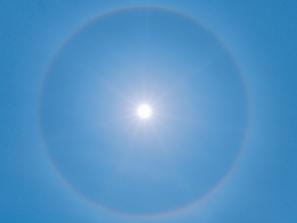 blue sky with white sun