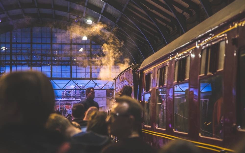 people in train station during night time