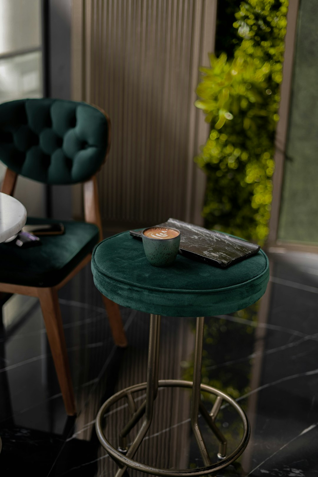 green ceramic bowl on brown wooden table