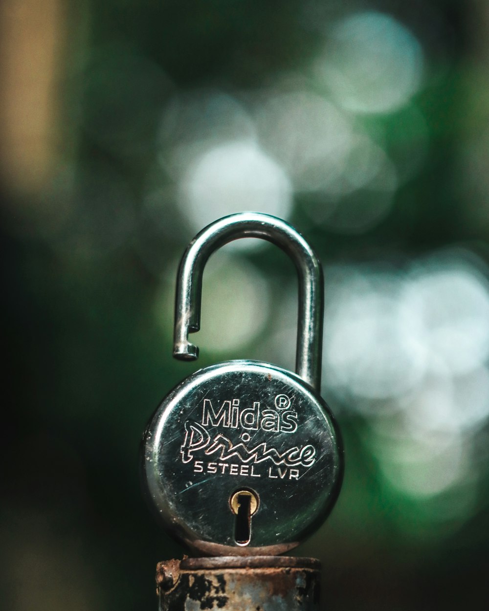 silver padlock on gray steel handle