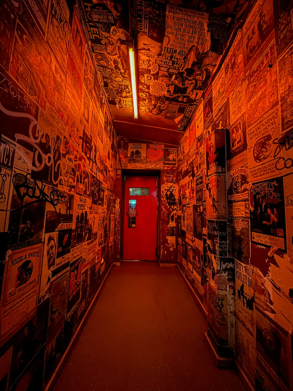 hallway with wall mounted paintings