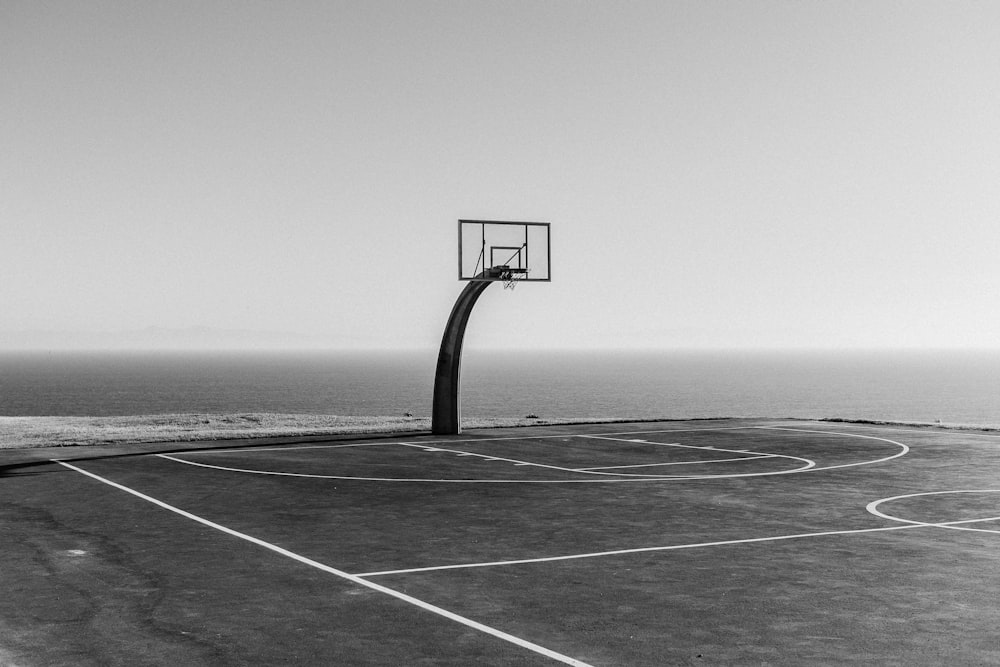 basketball hoop in grayscale photography