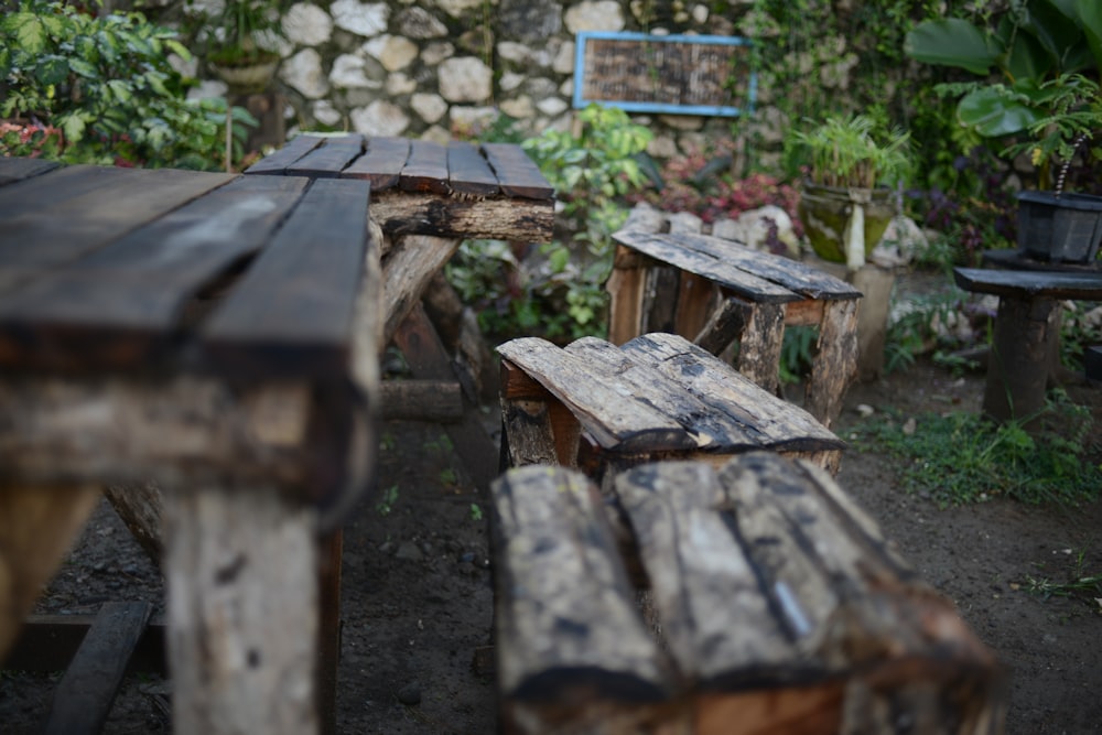 brown wooden table near green trees during daytime