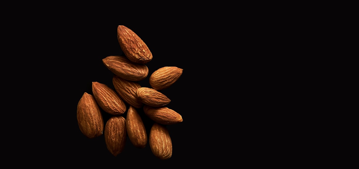 brown coffee beans on black background