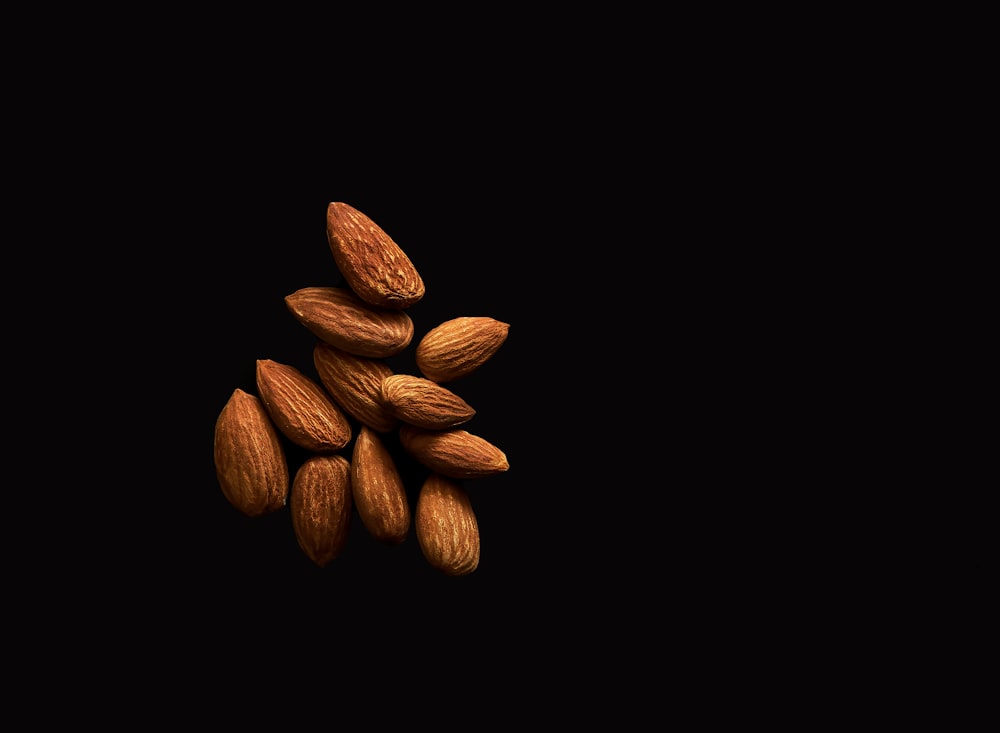 brown coffee beans on black background