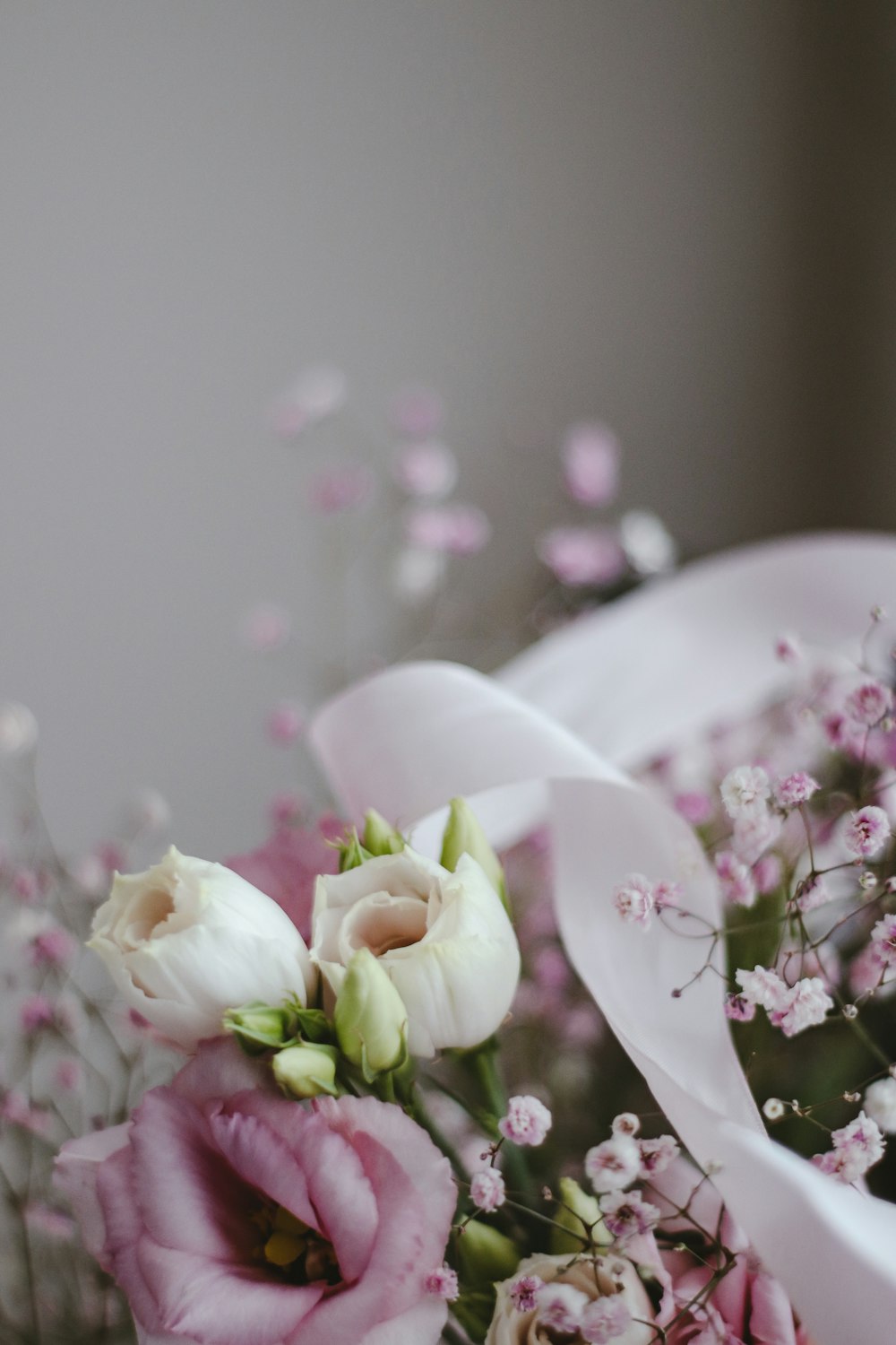 white and pink flowers on white ceramic plate