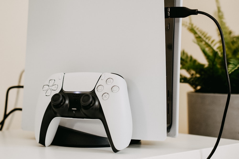 white and black xbox one game controller