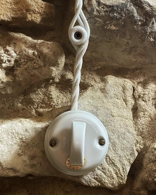 A close-up of a smart switch installed on a wall.