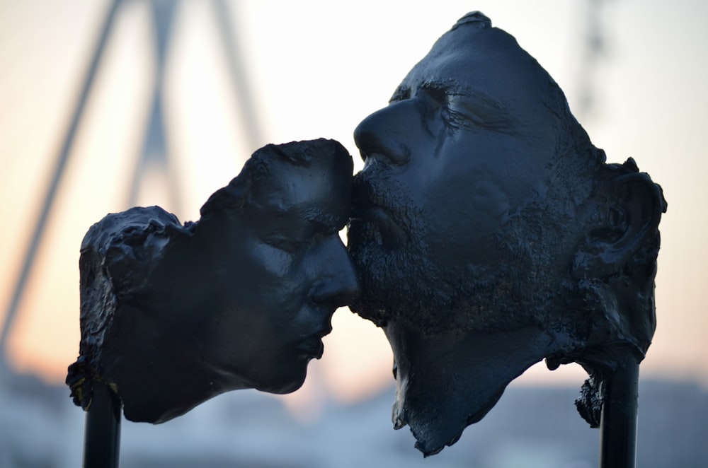 black statue of man and woman