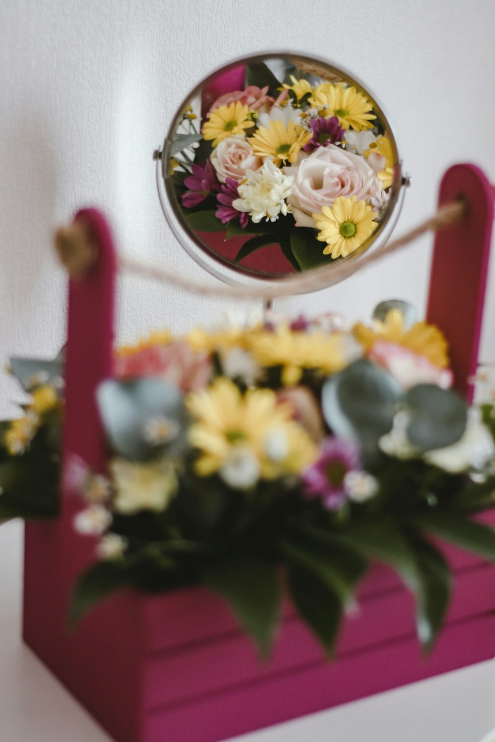 white and yellow flowers on red steel frame