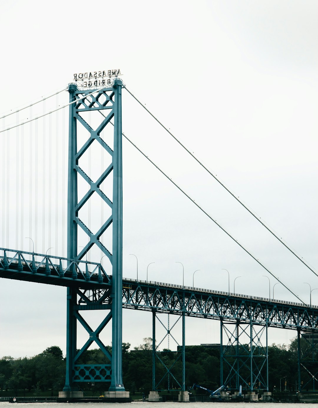 gray metal bridge under white sky during daytime