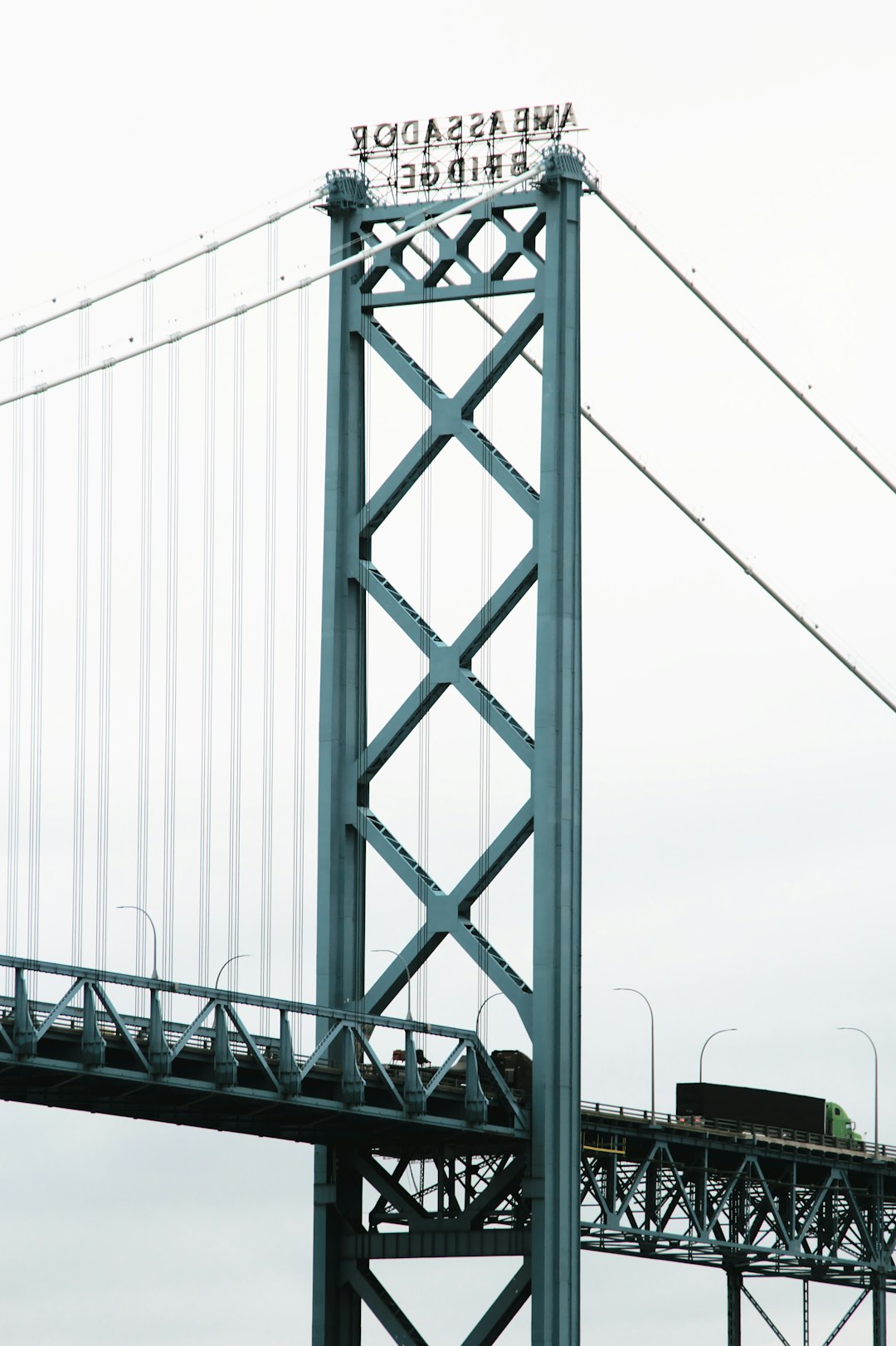 gray metal bridge under white sky during daytime