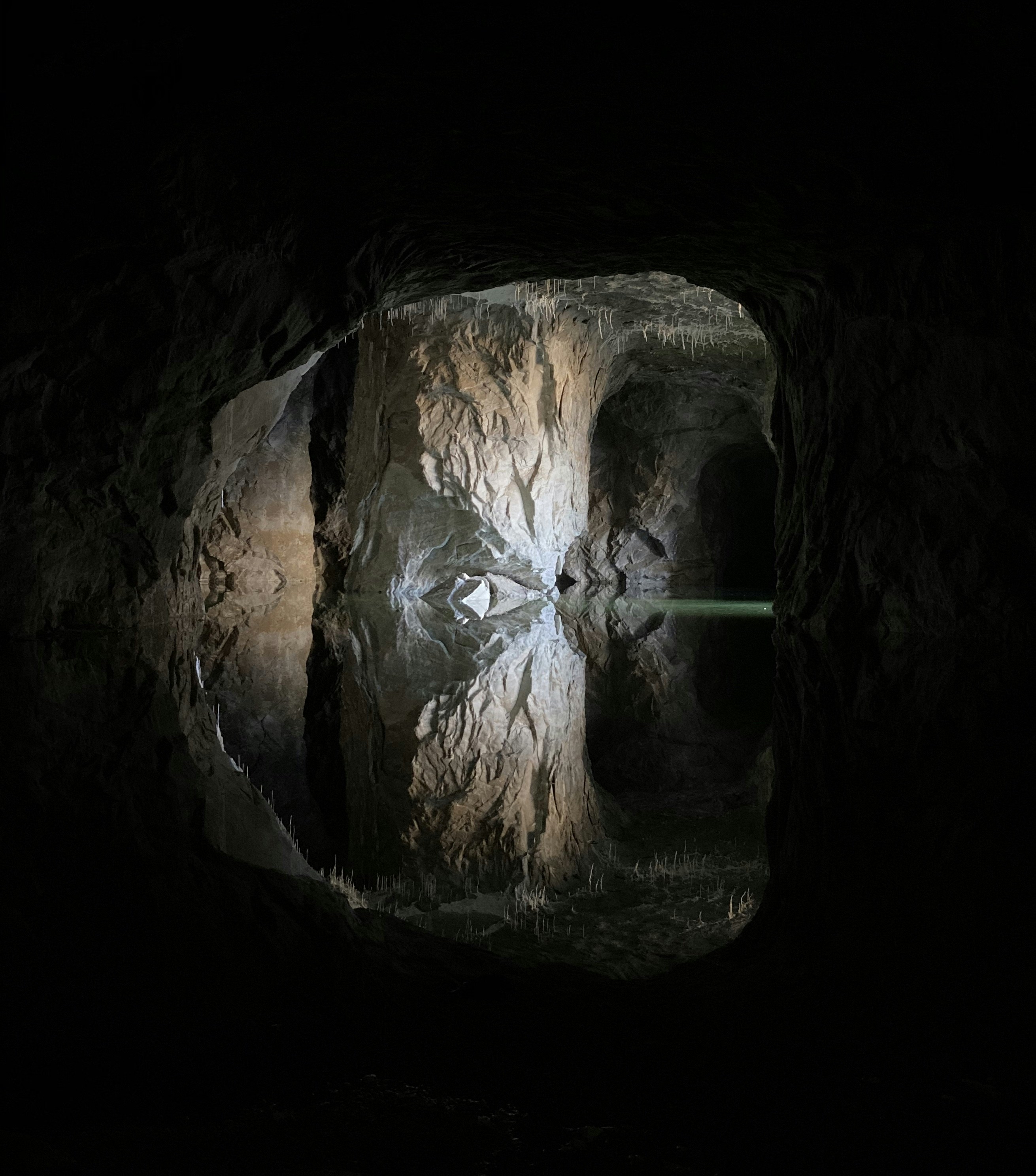 brown and black cave with hole