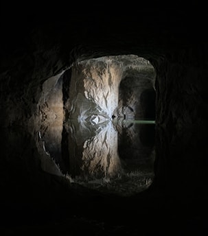 brown and black cave with hole