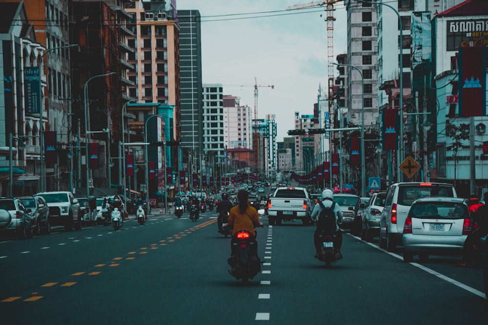 people crossing on pedestrian lane during daytime