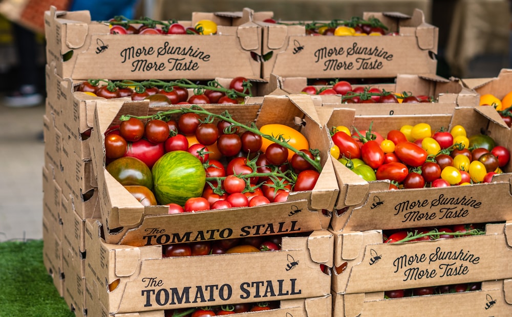 red and green apples on brown cardboard box