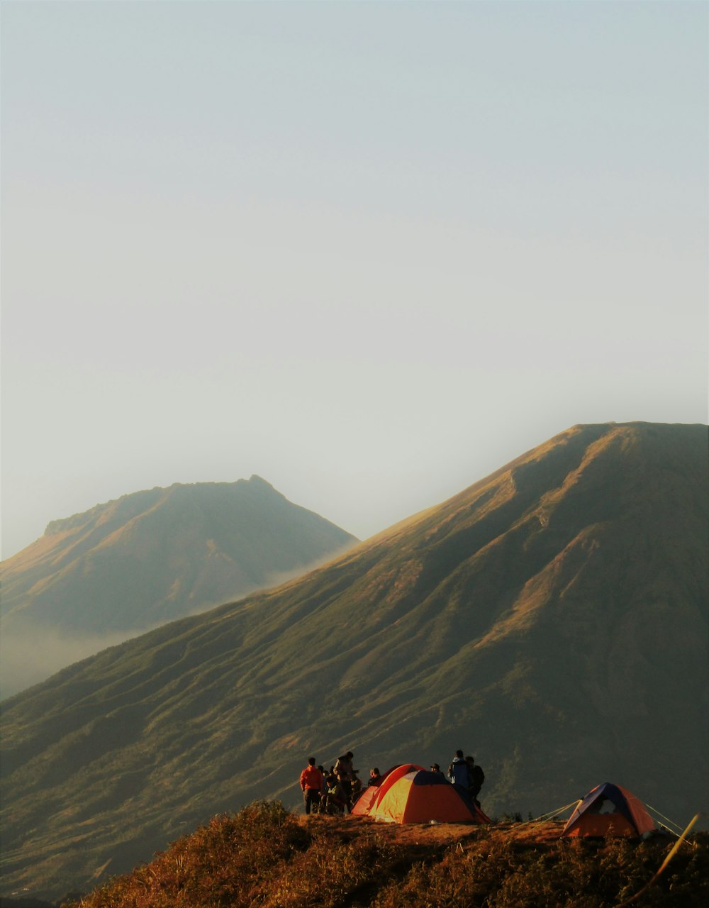 people on top of mountain during daytime