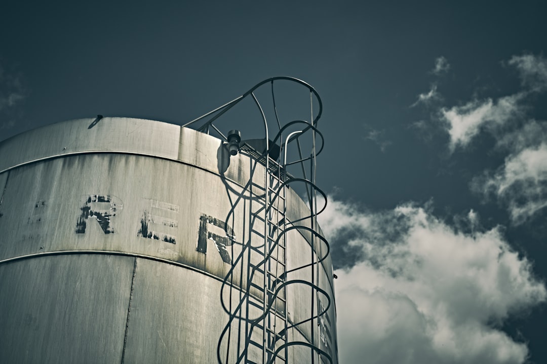 brown wooden barrels under blue sky