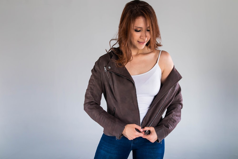 woman in black blazer and blue denim jeans