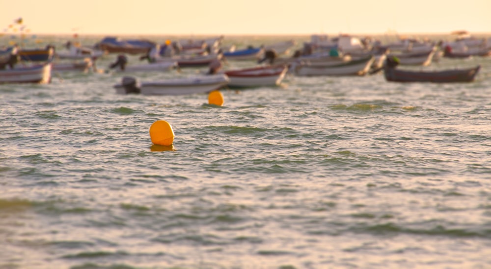 yellow and orange kayak on sea during daytime