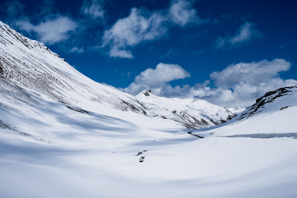 snow covered mountain under blue sky during daytime