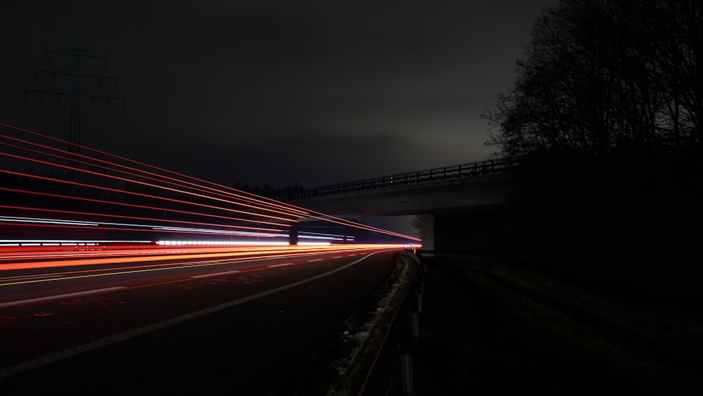 time lapse photography of cars on road during night time