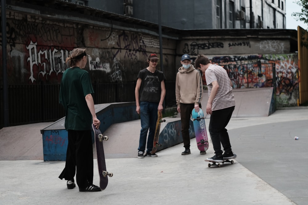 Man in green polo shirt and blue denim jeans holding black skateboard photo  – Free Moscow Image on Unsplash