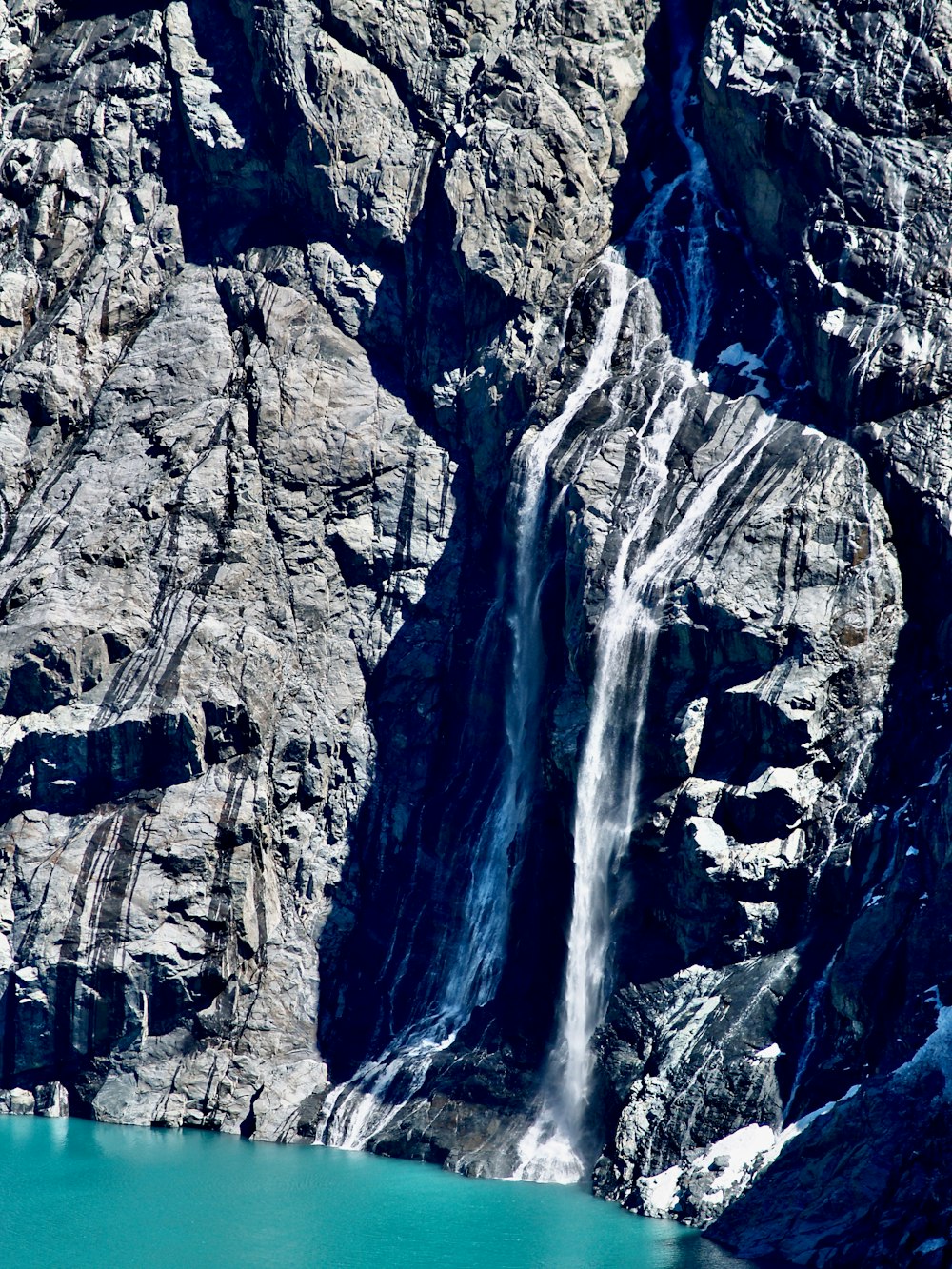 water falls on rocky mountain