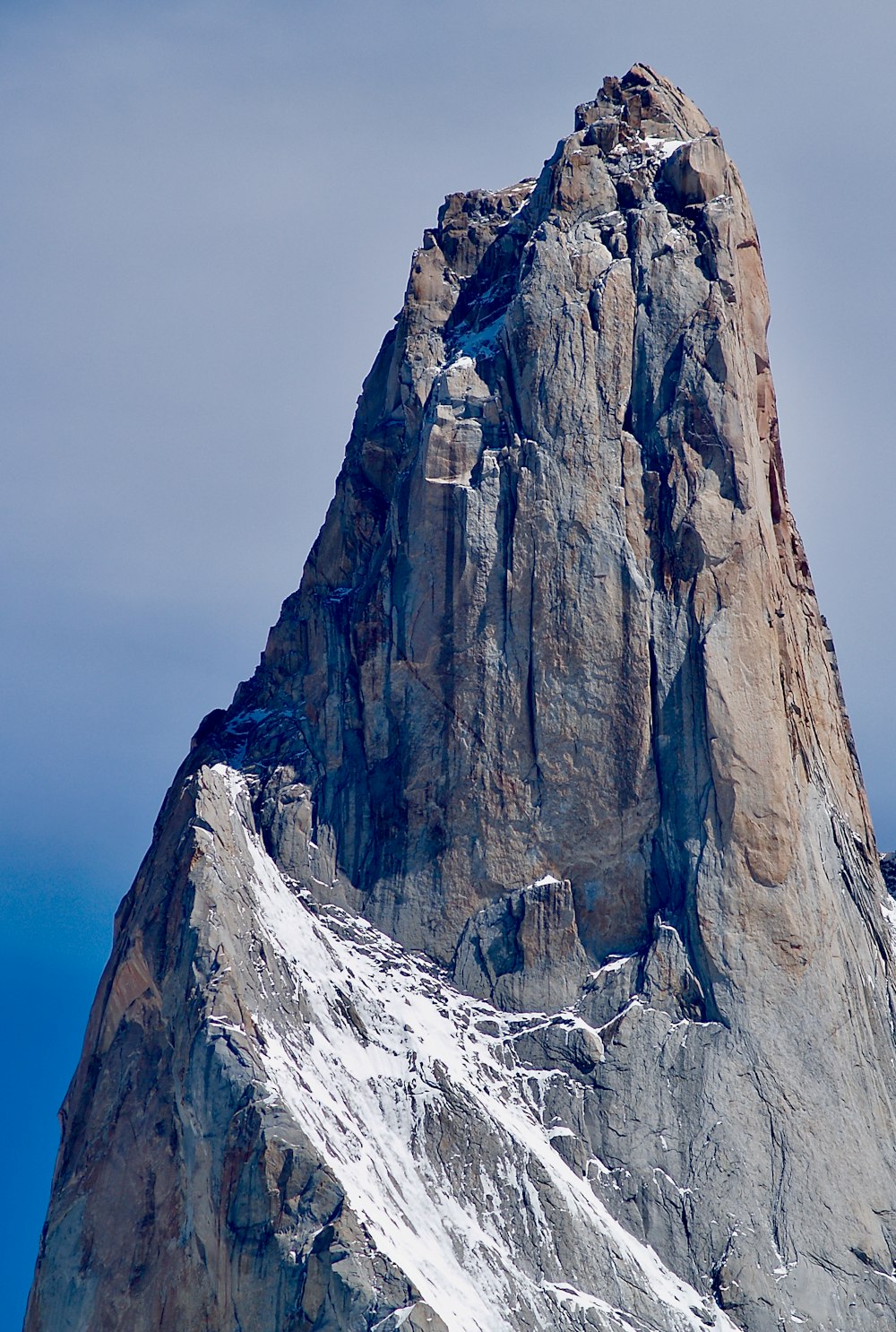 gray and white rocky mountain under gray sky