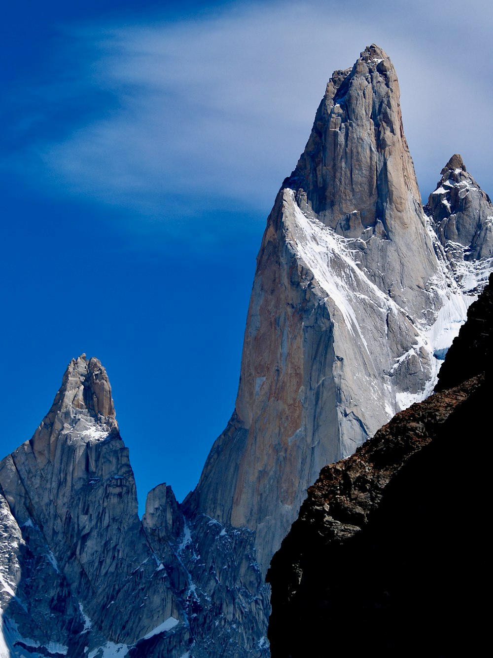 snow covered mountain under blue sky during daytime