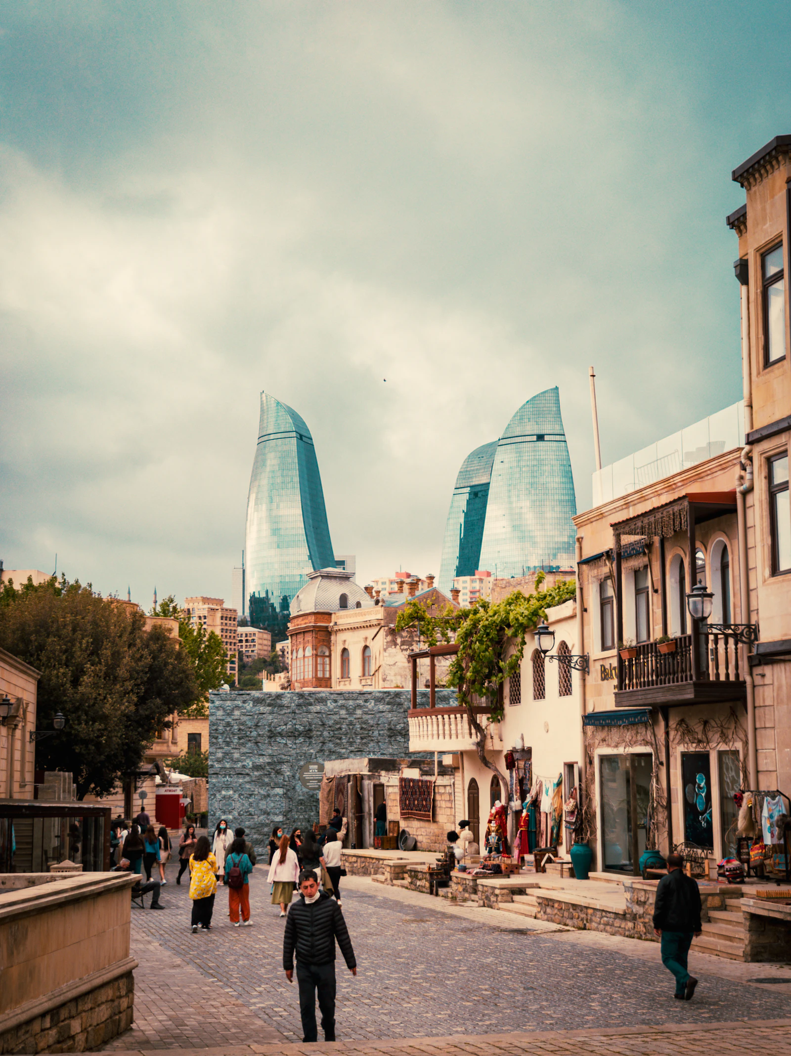 Street in Baku Old City with modern towers beyond