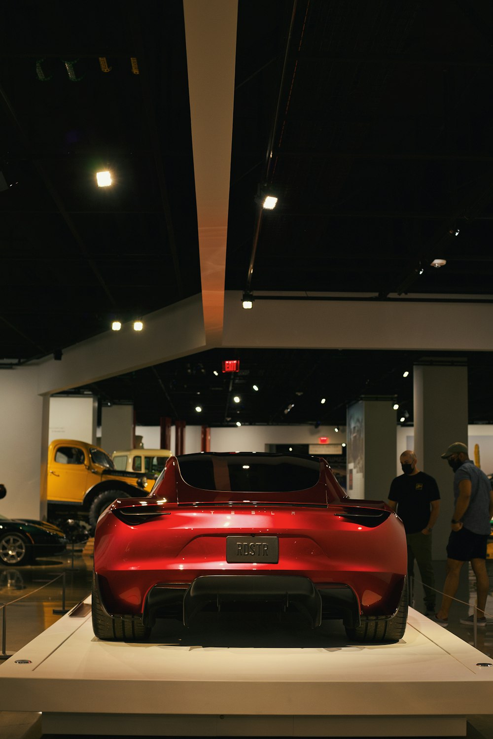 red car in a parking lot