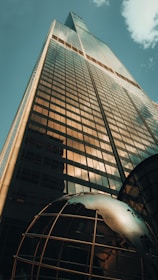 a very tall building with a sky background