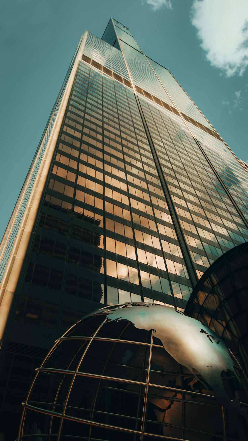 a very tall building with a sky background