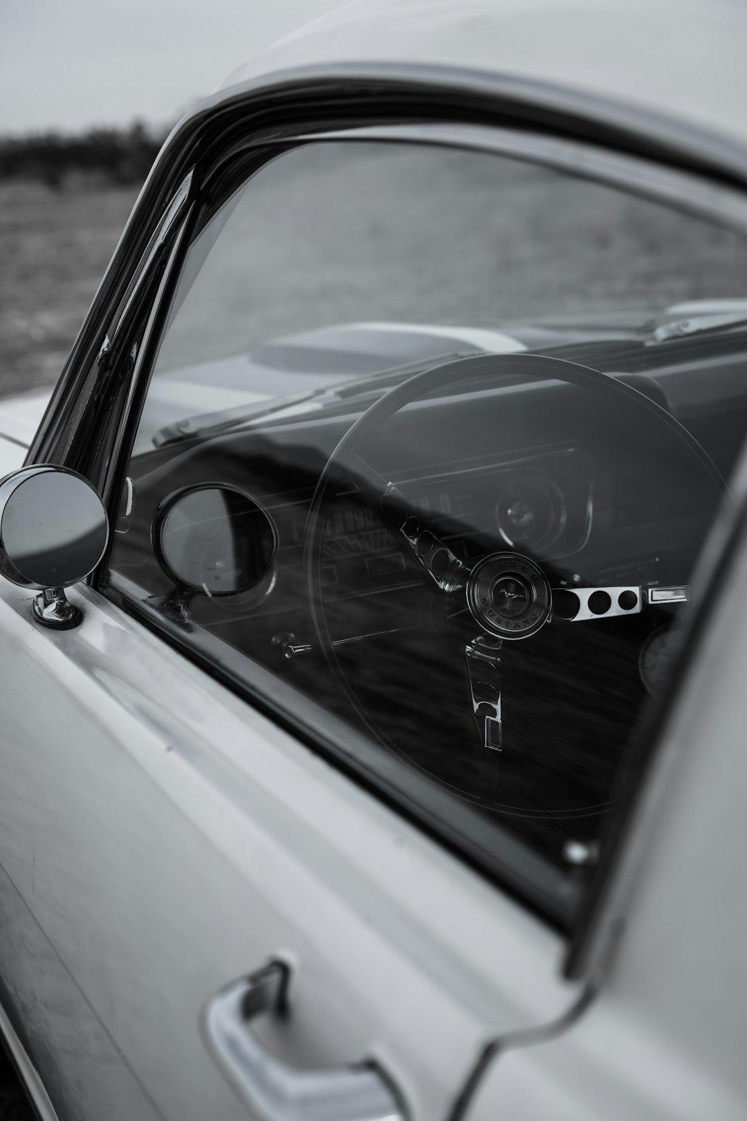 black mercedes benz car with white car door