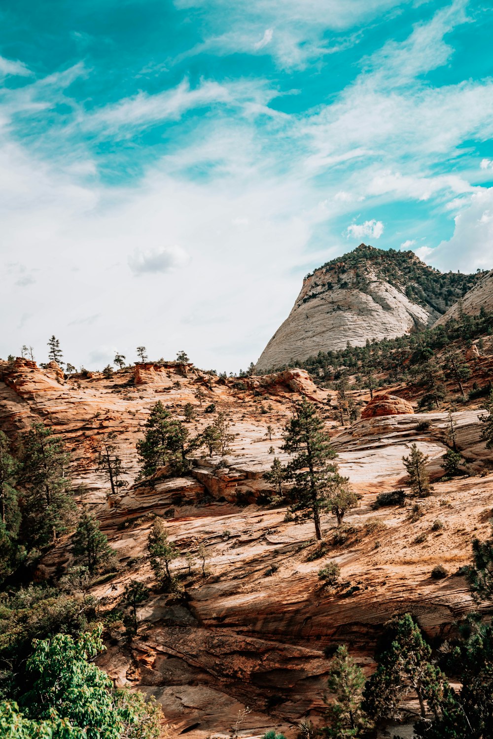 brown rocky mountain under blue sky during daytime