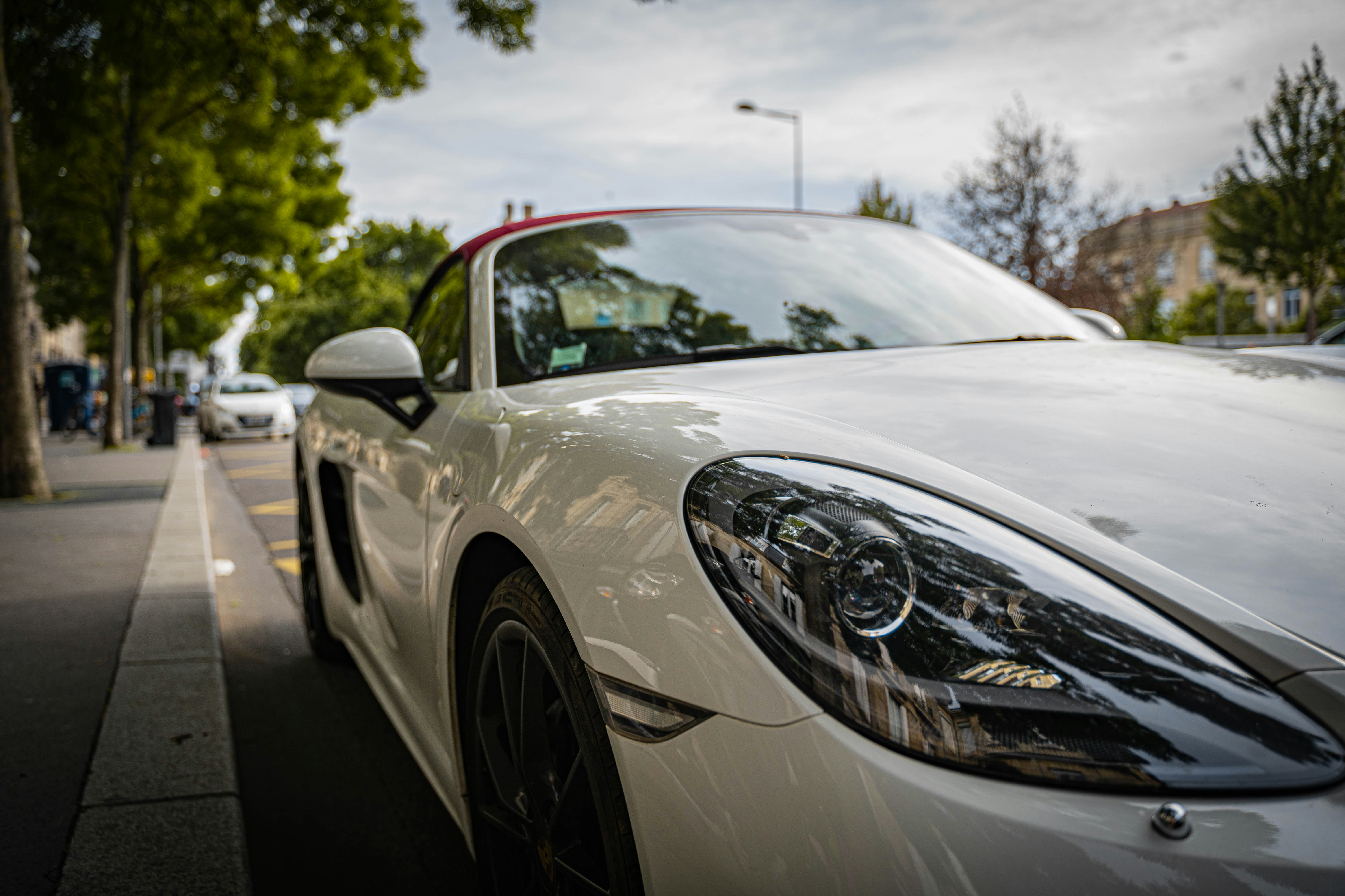 white porsche 911 on road during daytime