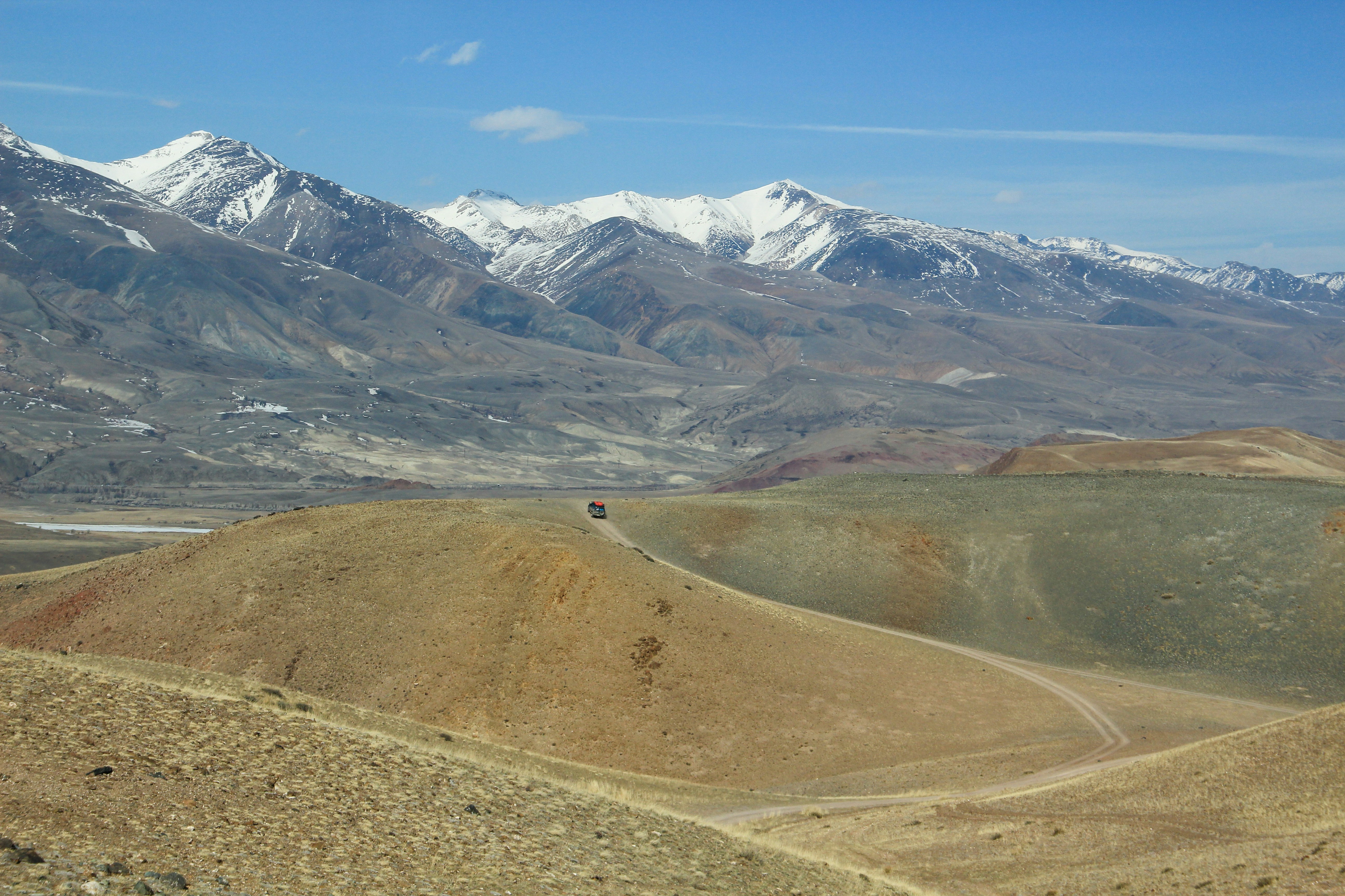 brown and white mountains under blue sky during daytime
