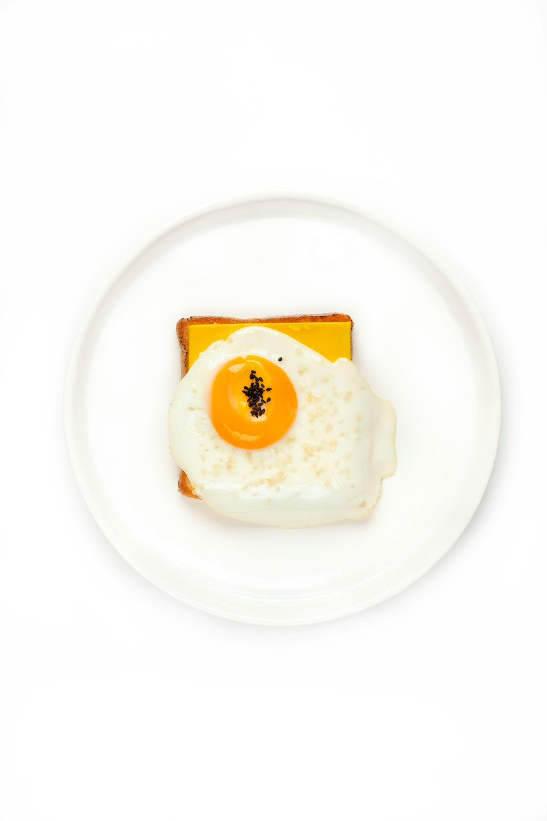  white and yellow egg on white ceramic plate dish