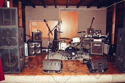 Sound system installation with mixers and microphones in a cozy venue.