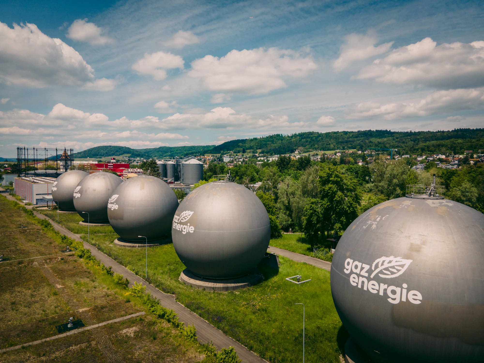 Covered digester dome in grassland.