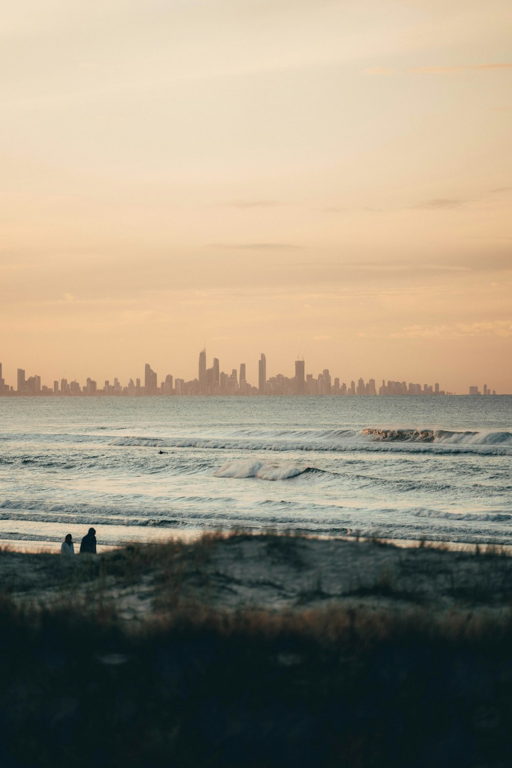 people surfing on sea waves during daytime