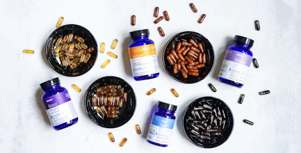 blue and white plastic bottle beside brown round ashtray