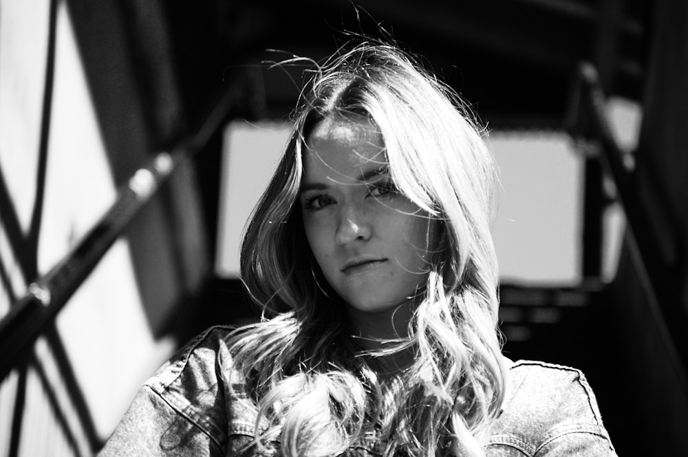 grayscale photo of woman in floral shirt