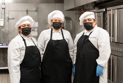 2 men in white chef uniform standing