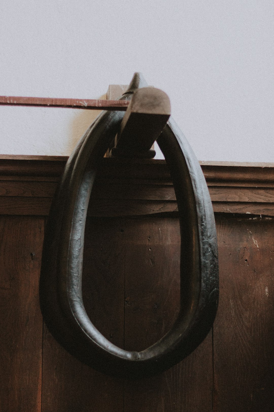 black steel handle on brown wooden door